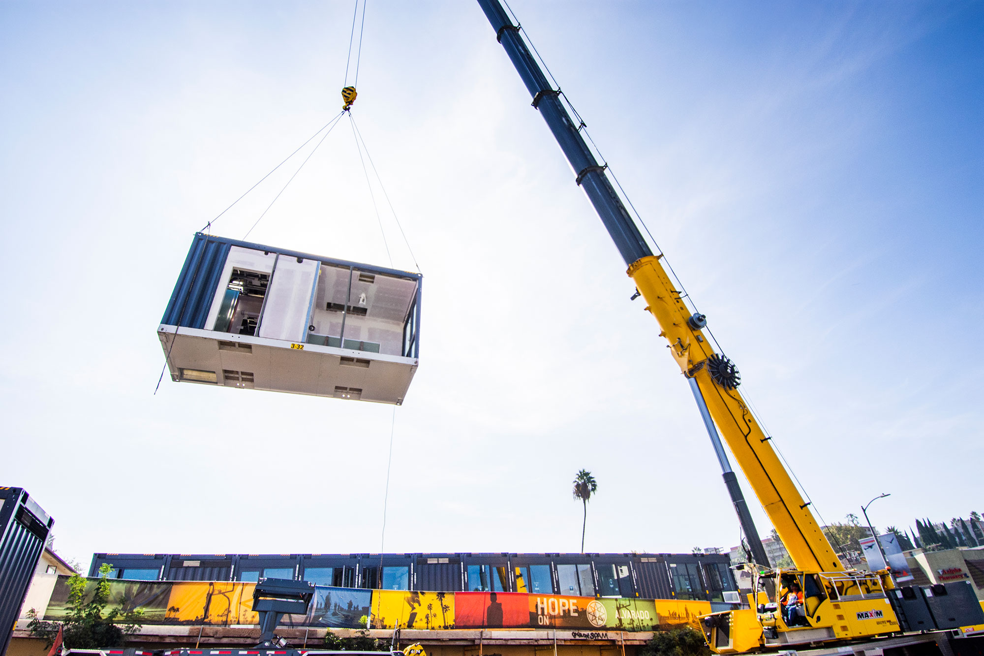 Crane Hoists a Quick Build Modular Housing Unit